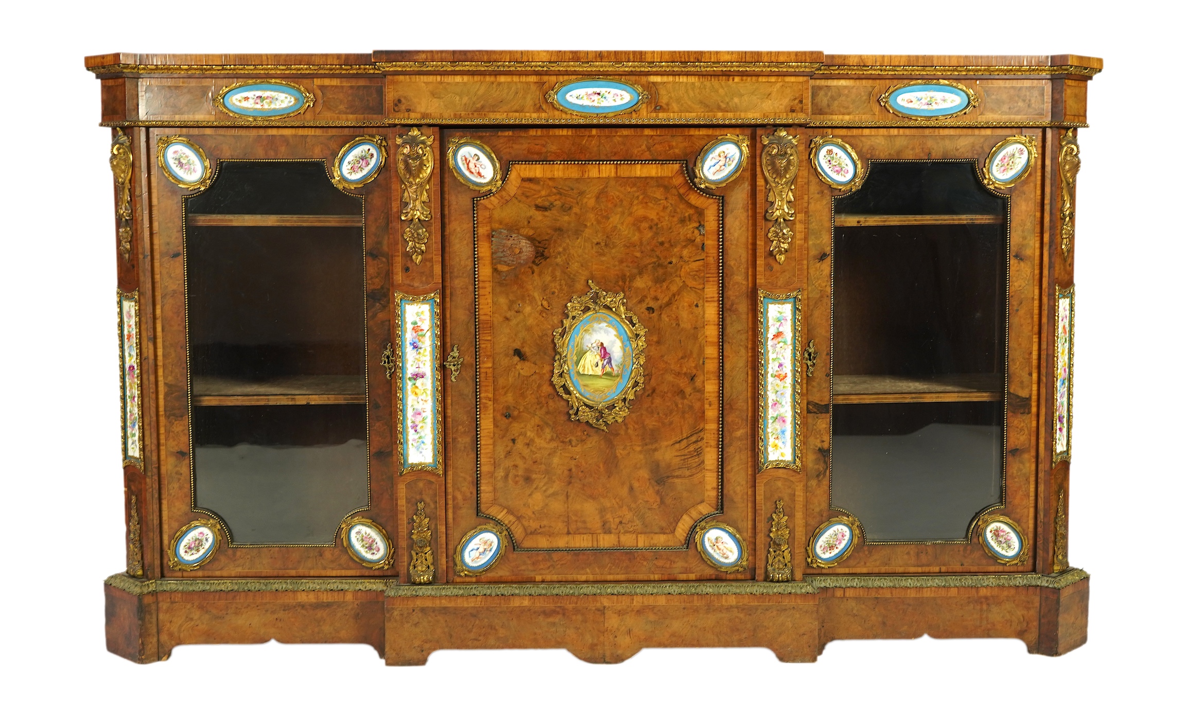 A Victorian tulip banded and gilt metal mounted walnut breakfront side cabinet